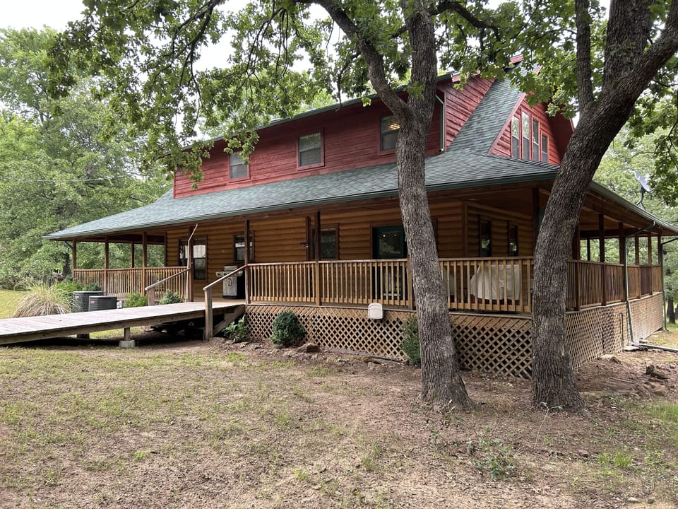 Wrap around porch gives extra living space and a place to grill and enjoy nature