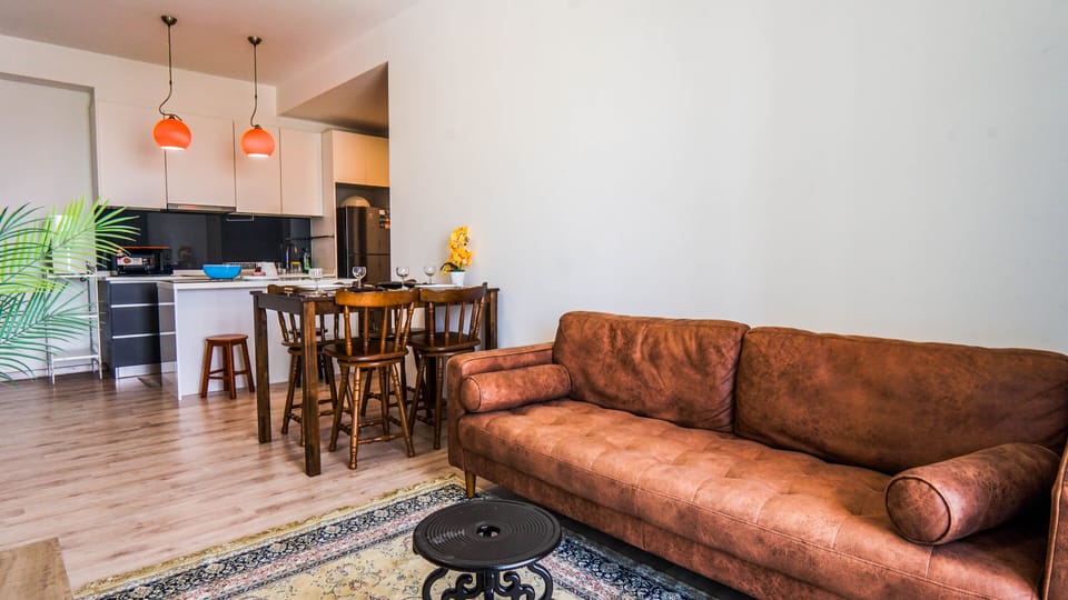 Superior Apartment | Living area | 42-inch Smart TV with cable channels