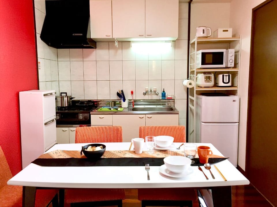 Basic Apartment | Living area | 19-inch flat-screen TV with satellite channels