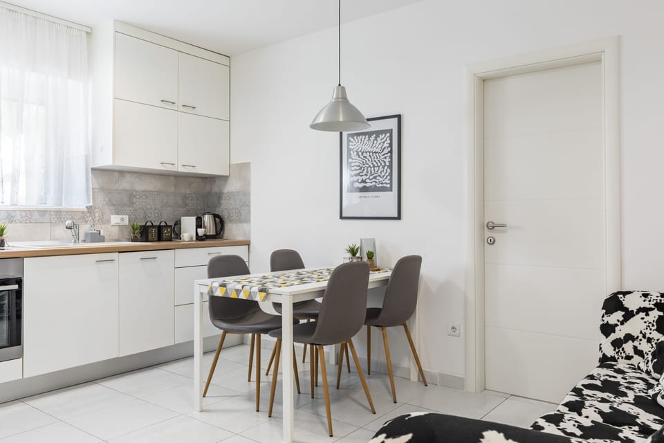 Deluxe Apartment | Living area | 150-cm LCD TV with digital channels, TV, toys