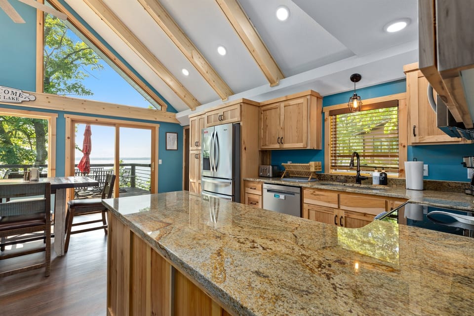 The view of our brand new kitchen as you get to the top of the stairs. Hi, Gull Lake!