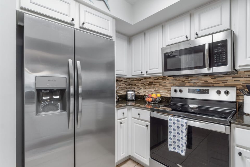Full size refrigerator & freezer with filtered water and ice maker.