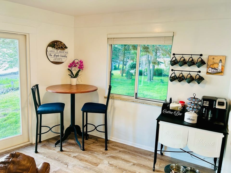 Coffee bar with single serve and pot style maker, filters, k-cups, and grounds.