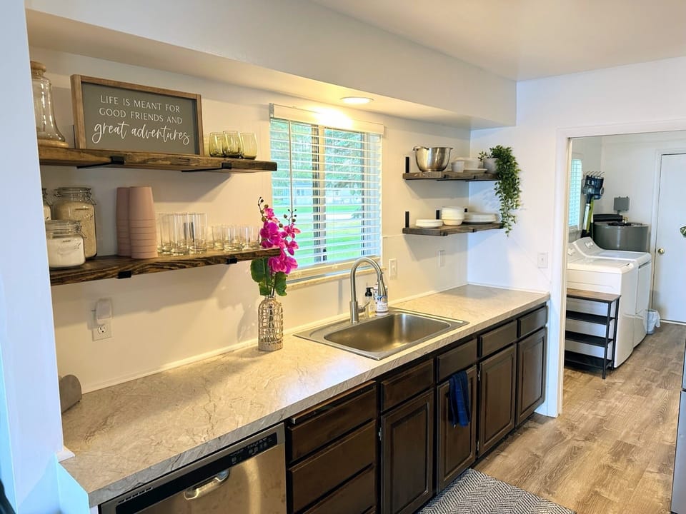 Open shelving to make finding items easy, dishwasher as well.