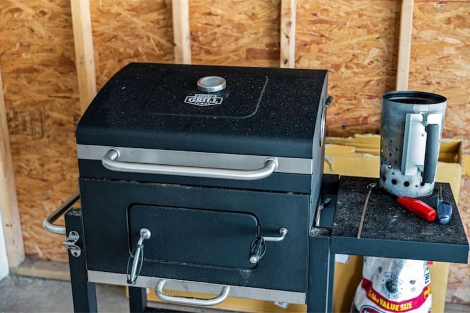 A grill and tools for your BBQ fun, use a bag of charcoal, replace a bag.