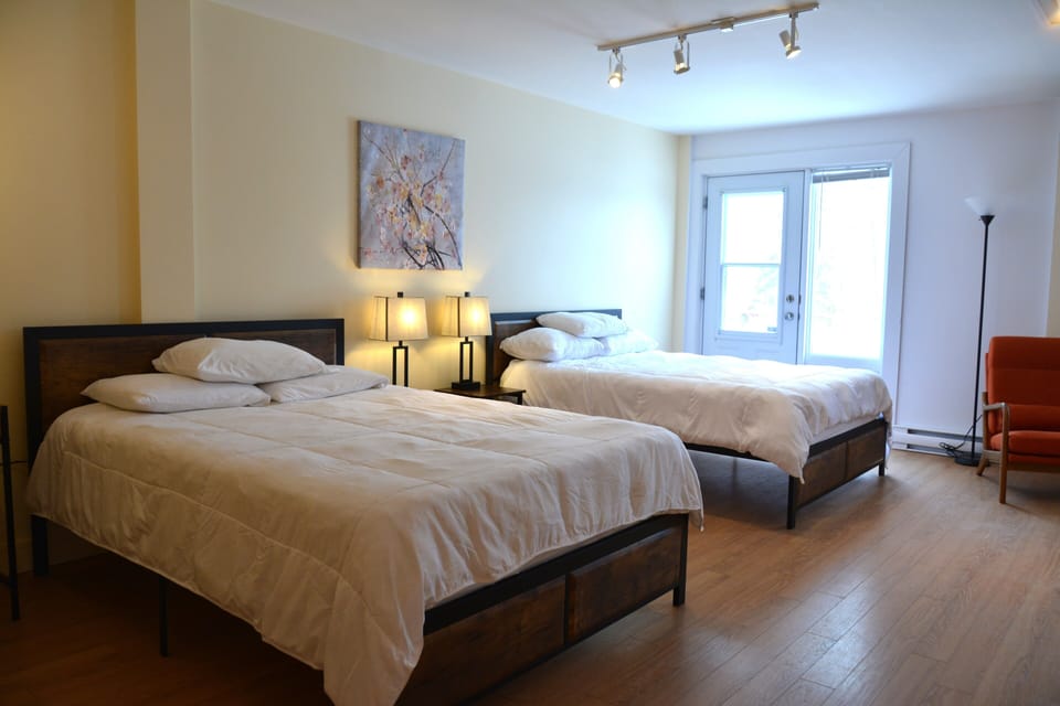 Comfort Studio Suite, 2 Queen Beds | Living area | Flat-screen TV, foosball, table tennis