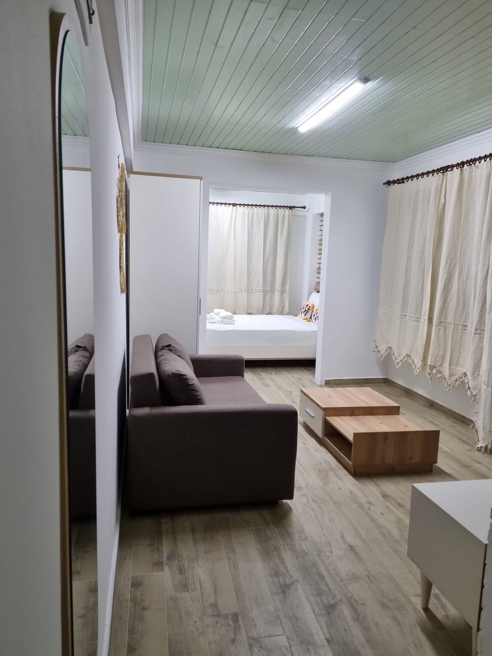 Design Apartment, 1 King Bed with Sofa bed, Courtyard View, Garden Area | Living area | 82-cm Smart TV with satellite channels, TV