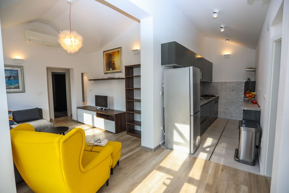 Superior Apartment, 2 Bedrooms, Sea View | Living area | 32-inch LED TV with cable channels, TV, heated floors