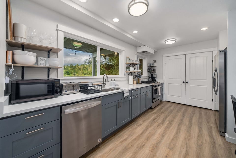 The primary living space provides a fully furnished kitchen and a dining area