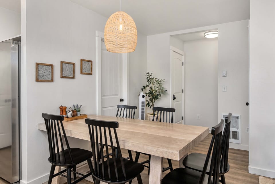 The primary living space provides a fully furnished kitchen and a dining area