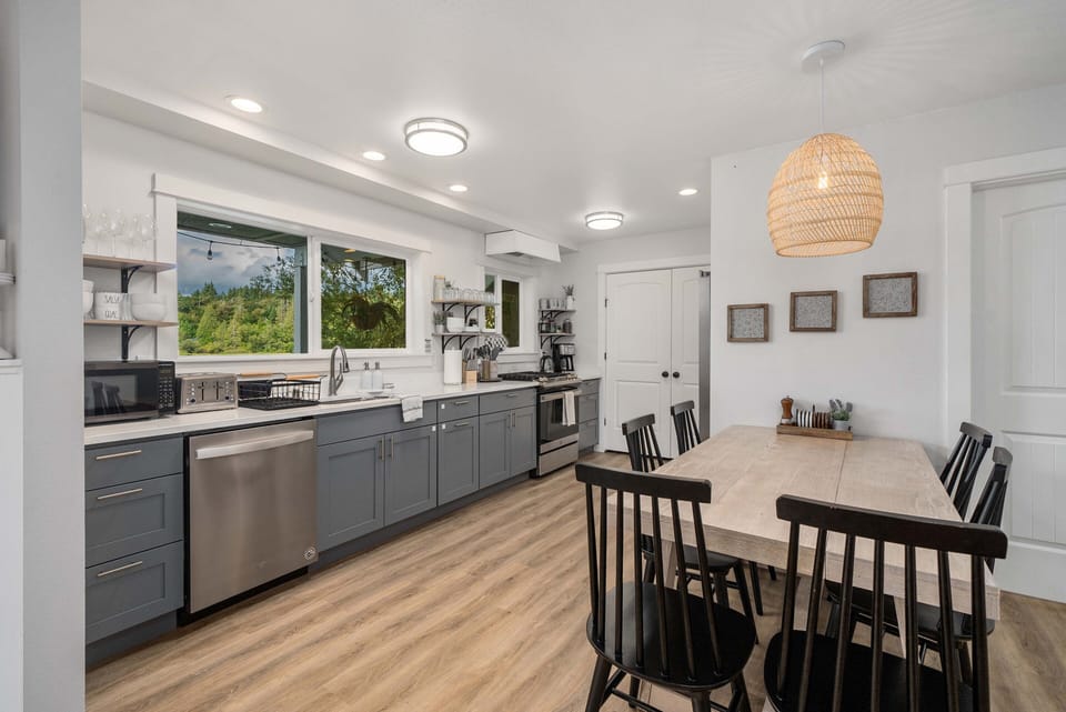 The primary living space provides a fully furnished kitchen and a dining area