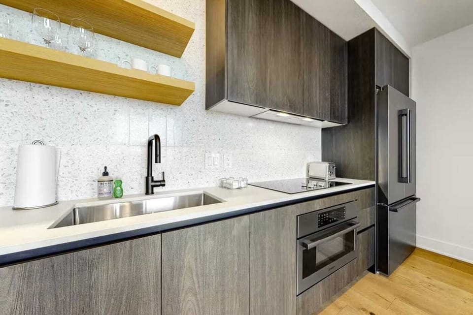 Luxury Condo, 1 King Bed with Sofa bed, City View | Private kitchen | Full-size fridge, microwave, stovetop, dishwasher