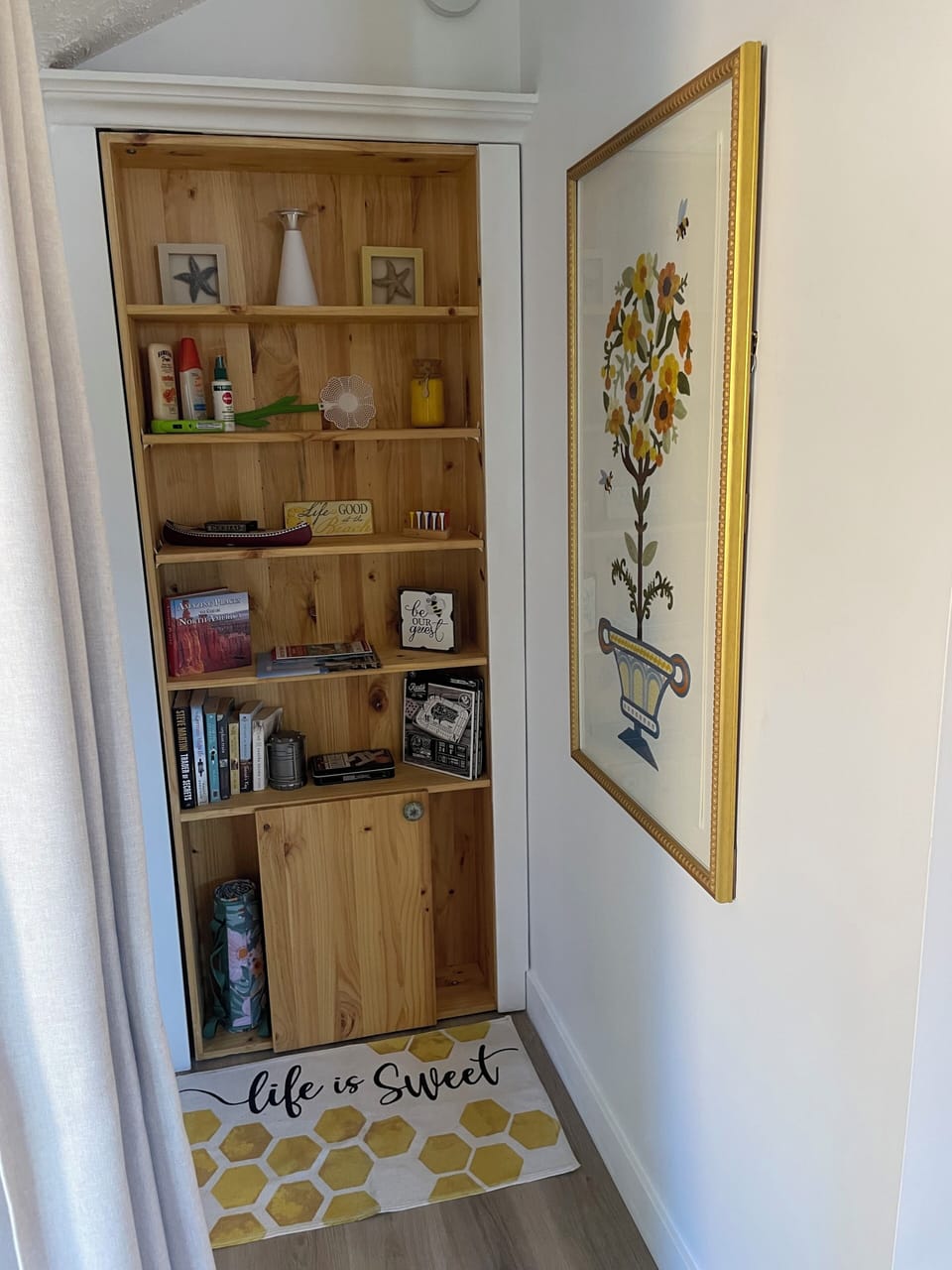 Bookshelf with games books sunscreen and bug spray