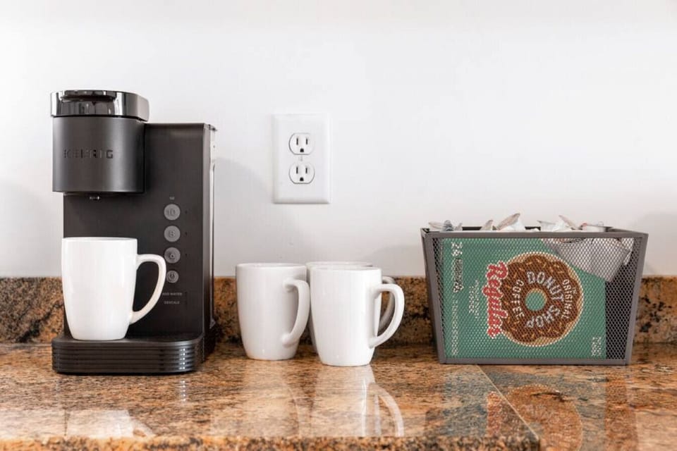 Kitchen equipped with a Keurig coffee maker; coffee pods provided.