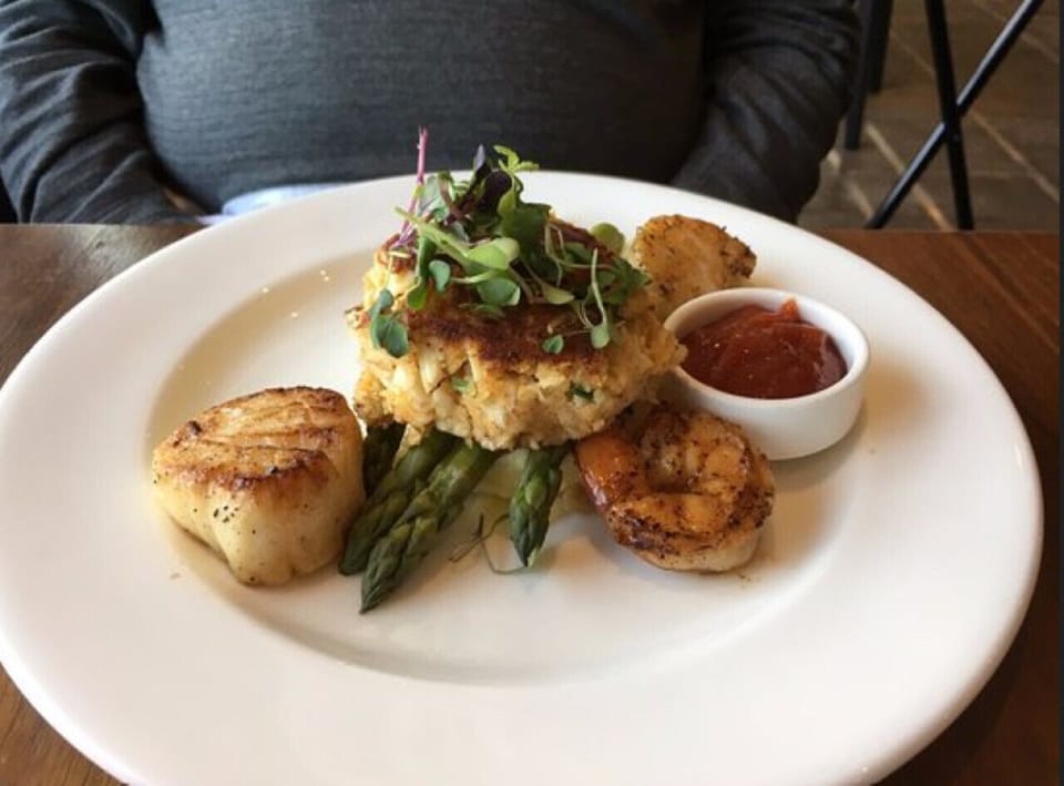 Savor fresh seafood and riverside views at The Boathouse at City Point—where the Appomattox and James Rivers meet.
