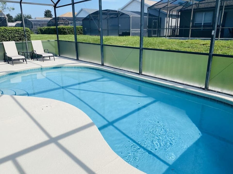 Private pool with sunloungers.