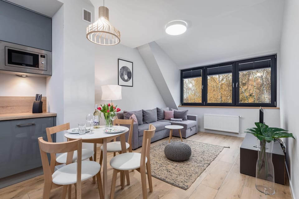 Another angle of the living and dining area, highlighting the seamless blend of functionality and comfort.
