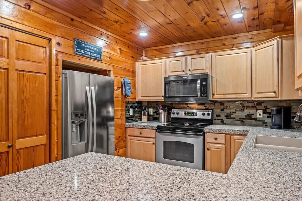 Kitchen is equipped with everything you need to make a meal or have a cookout.