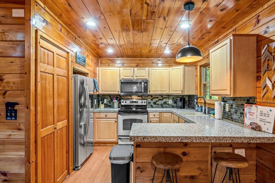 Fully equipped kitchen with a full suite of stainless steel appliances.