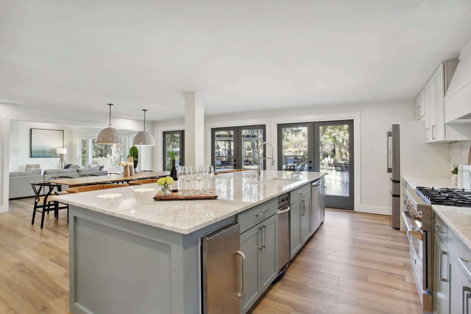 itchen | Fully Stocked Kitchen with Island and Bar Seating | First Floor