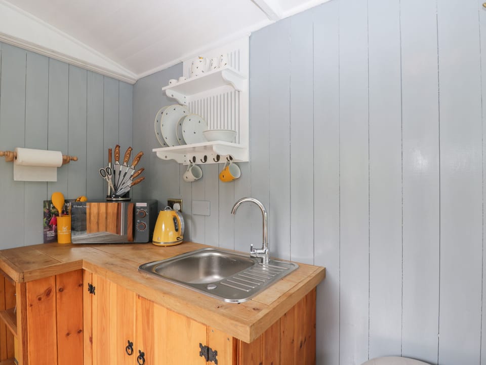 Fridge, electric kettle, toaster, cookware/dishes/utensils
