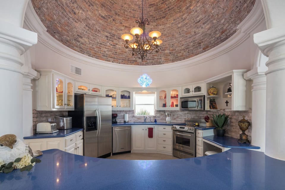 Kitchen w/ Stove, Fridge, Wine Cooler, Dishwasher, Ice Maker, and Microwave.