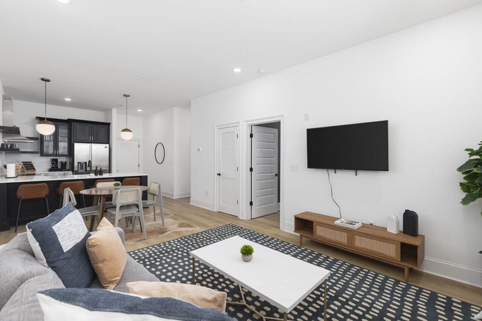 Living room with a queen sleeper sofa and Smart TV with all the streaming apps.