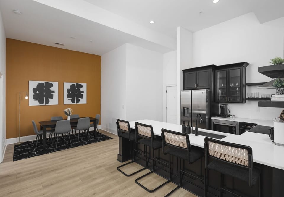 The open floor plan flows from the kitchen to the dining area.