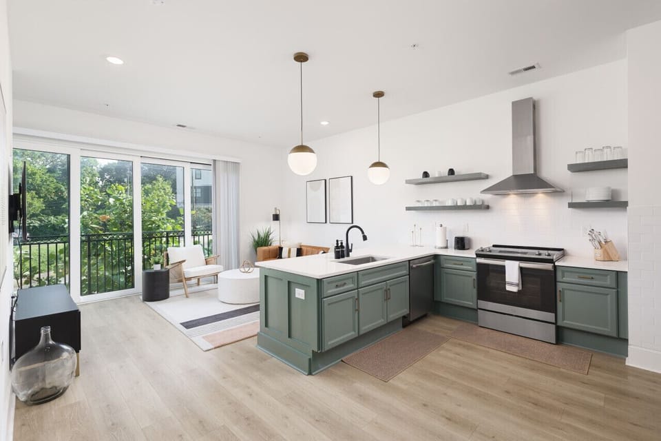 Beautiful open floor plan with lots of natural light, Smart TV, and seating for 4 at the kitchen counter.