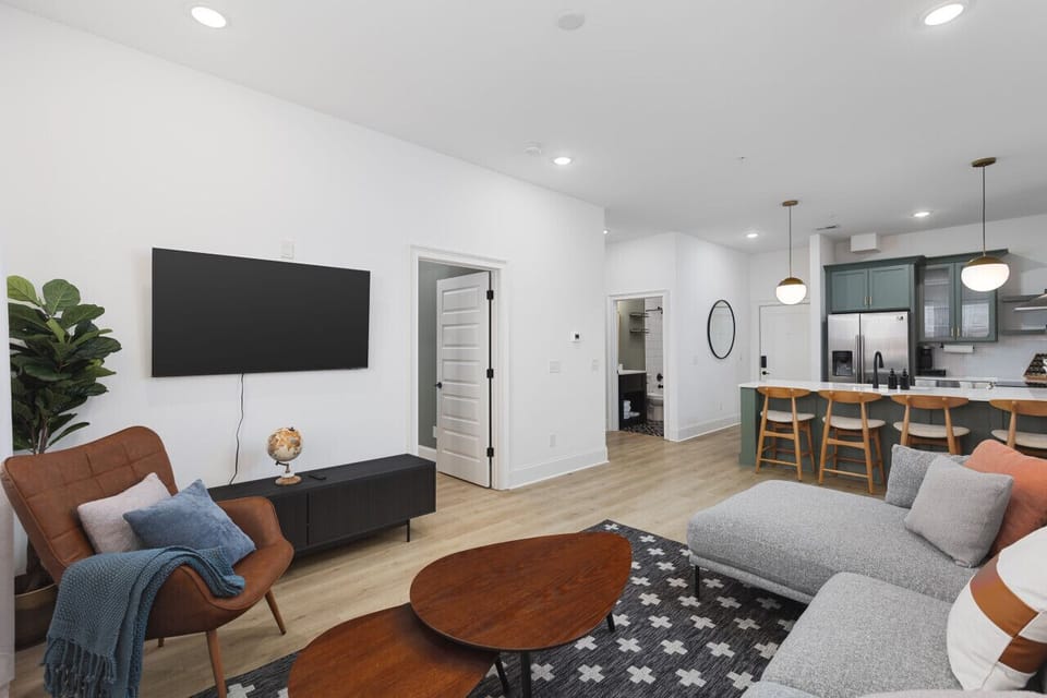 Relaxing living room with room-darkening shades and a Smart TV  with all the streaming apps.