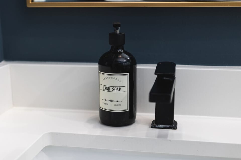 Primary bedroom's ensuite bath with a standing shower. All shower essentials and towels are provided.