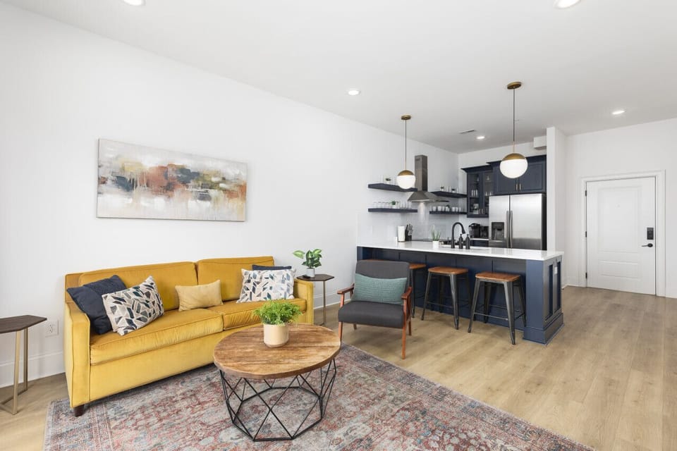 Our cozy living room features a Smart TV with all the streaming apps, a queen-size sleeper sofa, and a balcony to let in the natural light & fresh air.