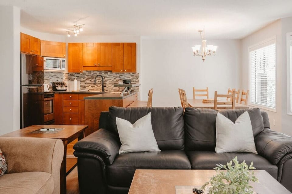 The living room expands into the dining area and kitchen.