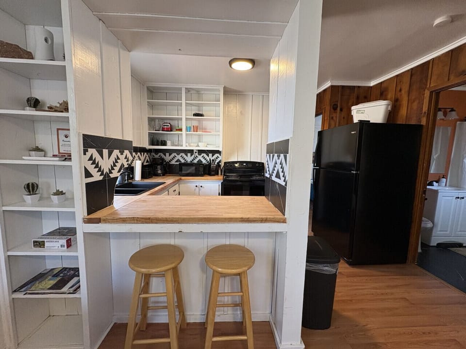 Cozy kitchen with breakfast bar seating for two