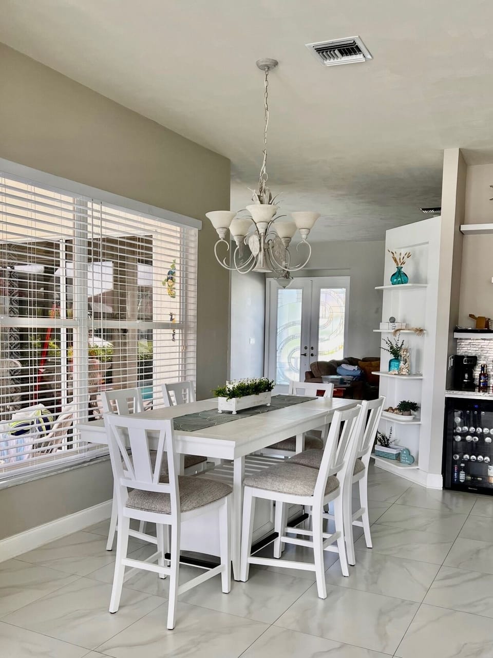 Dining room table seats 6 comfortably w/3 additional bar seats