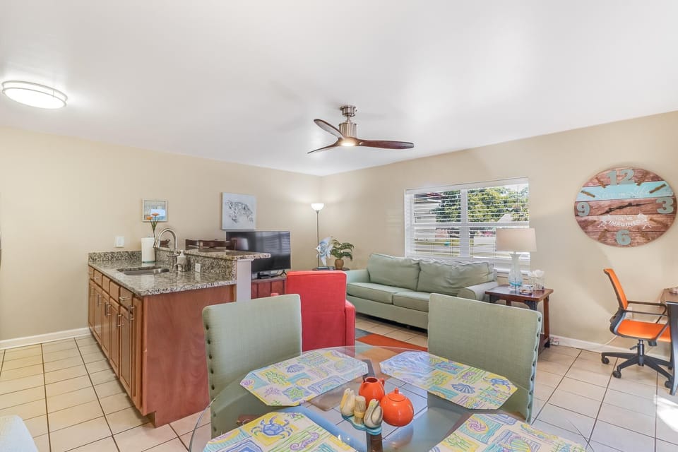 Spacious living room with kitchen table and bar area