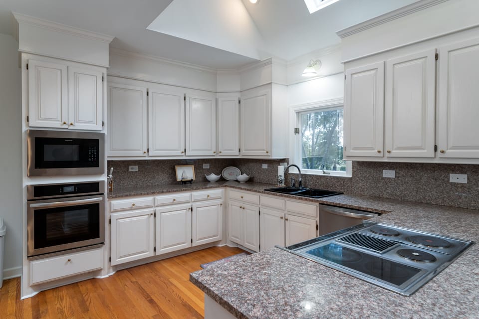 Vaulted ceiling with skylights let plenty of sunshine into this room