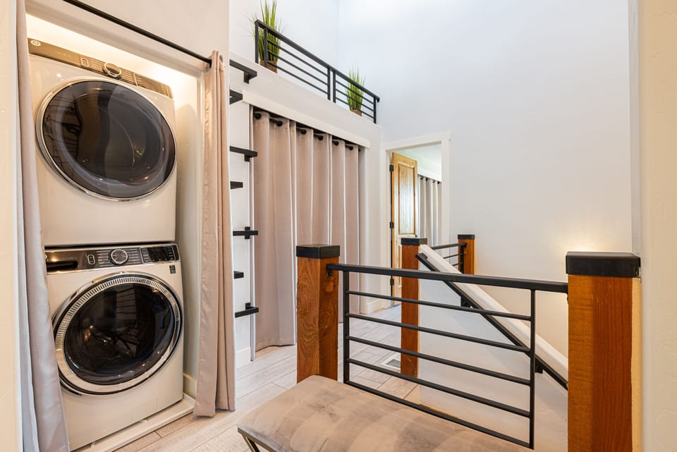 Upper level stacked washer and dryer