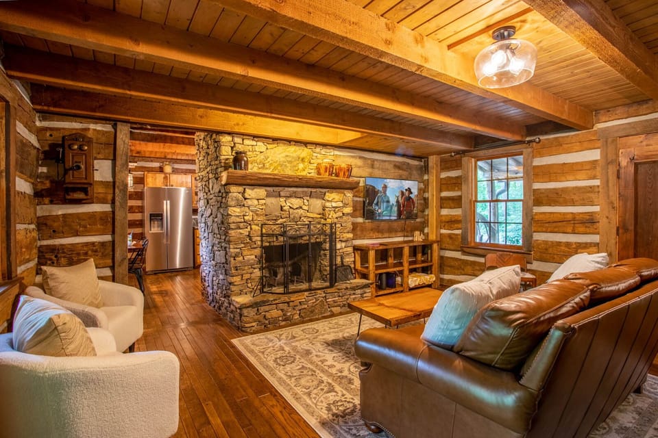 Living Room with Wood Burning Fireplace and Smart TV