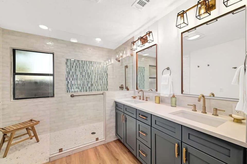 Bathroom 1- The Primary ensuite bathroom has a walk in shower and double vanity.