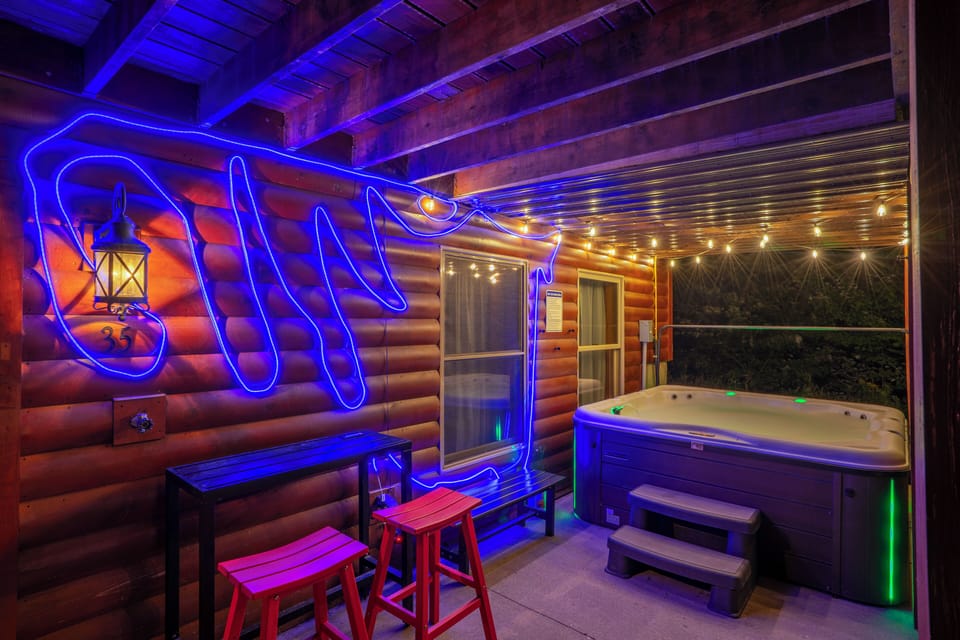 Soak in the hot tub under beautiful string lights, or sip your favorite drink.