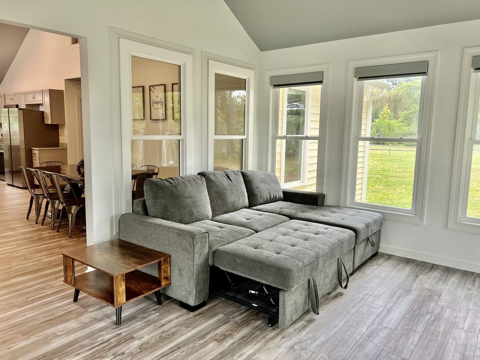 A L-shaped sofa bed that converts to a queen sized bed. 