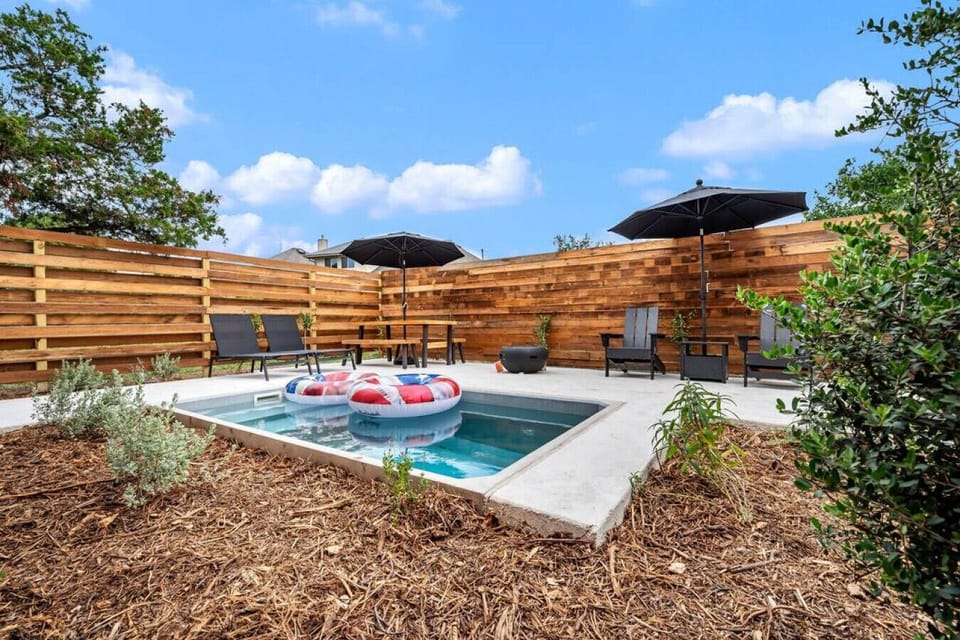 Texas Forever plunge pool with outdoor seating and BBQ pit
