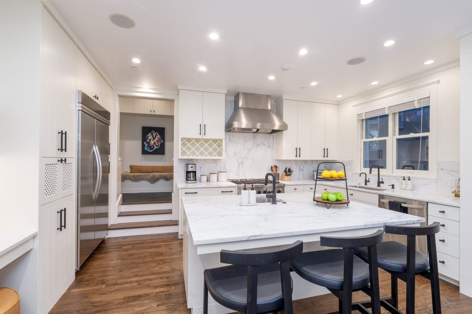 Custom designed chef's Kitchen featuring high-quality appliances, elegant finishes and ample storage space.