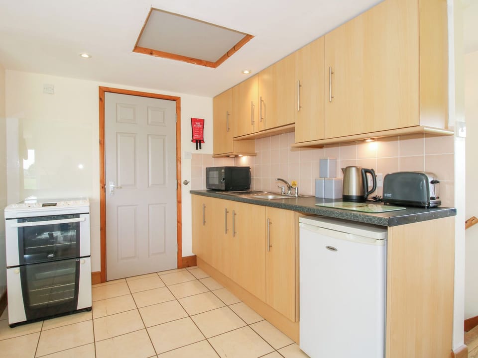 Fridge, electric kettle, toaster, cookware/dishes/utensils