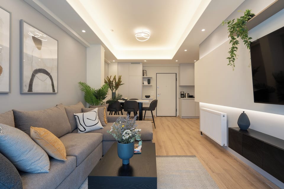 City Apartment | Living area | 55-inch Smart TV with cable channels