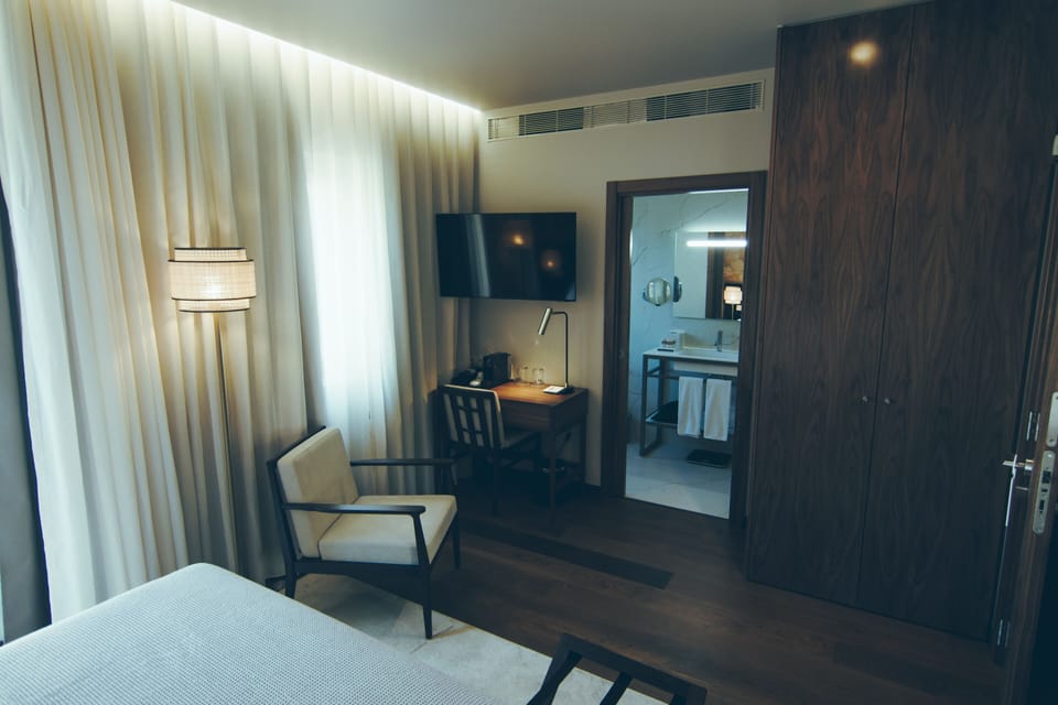 Deluxe Double or Twin Room | Minibar, in-room safe, individually decorated, individually furnished
