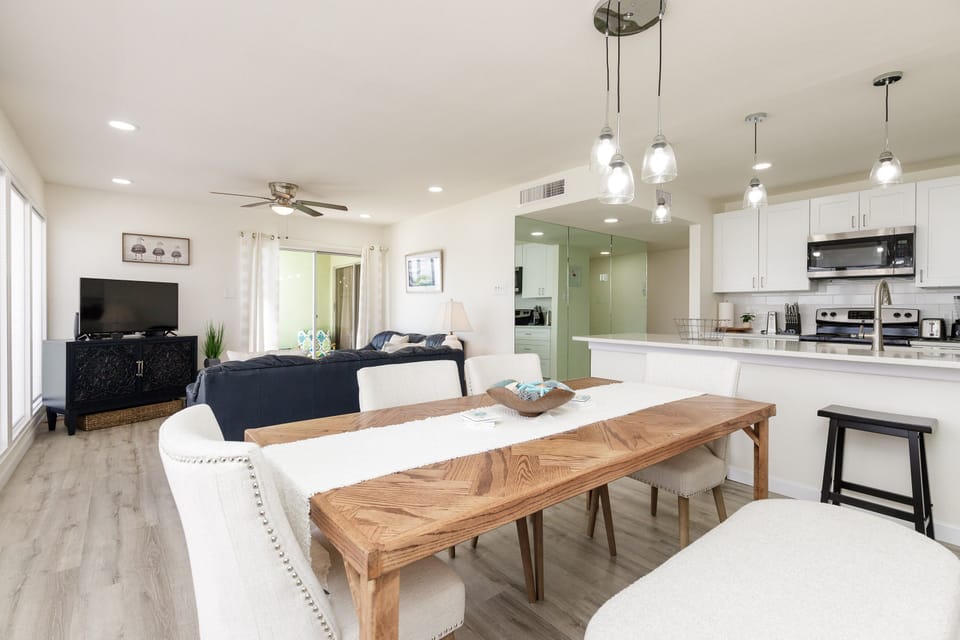 Relax in your bright open living space with modern kitchen, cozy seating, and stylish dining for memorable meals together.
