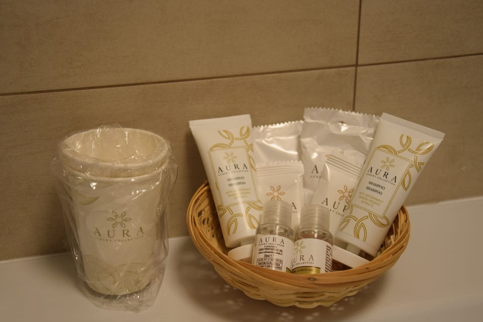 Shower, rainfall showerhead, designer toiletries, hair dryer