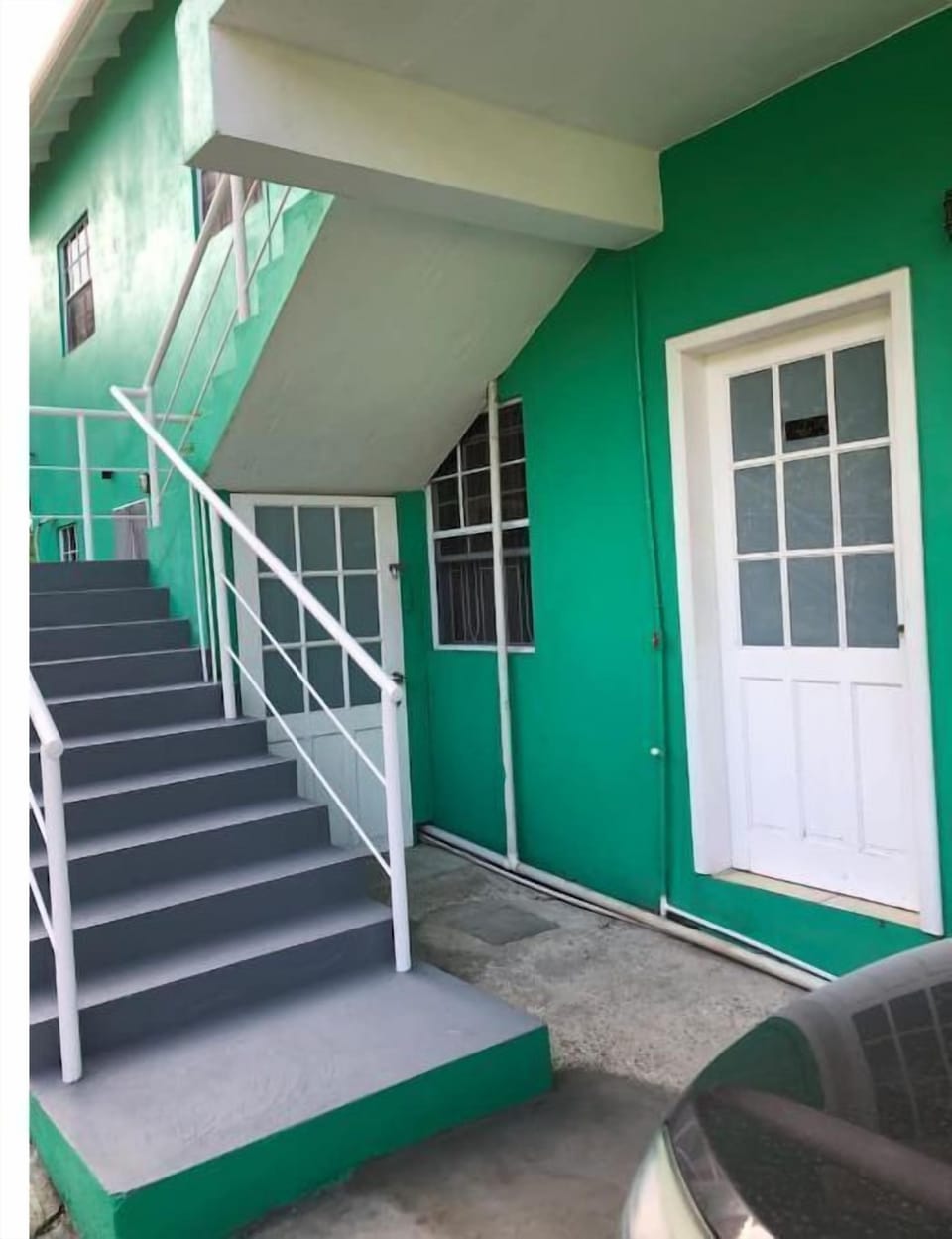 Side entrance through white door 